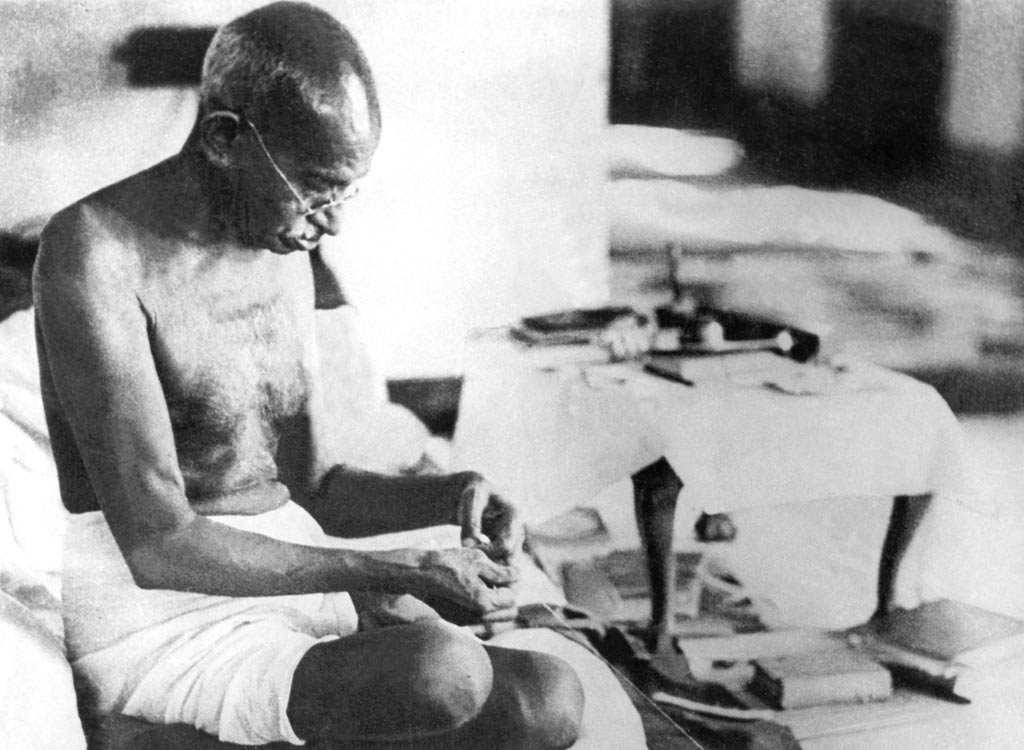 Gandhiji spinning thread at a charkha, 1942